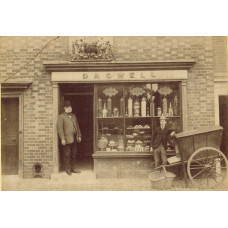 Exterior of Confectioner's shop 'Dagwell' with proprietor and cart, on reverse stamp of William Barnes, Photographer, Midhurst.