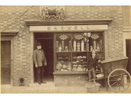 Exterior of Confectioner's shop 'Dagwell' with proprietor and cart, on reverse stamp of William Barnes, Photographer, Midhurst.