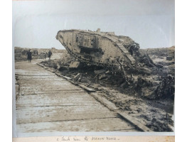 30 large professionally produced photographs of explosions, aeroplanes, zeppelin, ships, battlefields, ruins of Bapaume, Menin Road, Bethune, Arras and Ypres, tanks, soldiers, most 8 x 10in, with a further 24 aerial photographs taken by the flying corps f