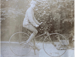 Man in cap on a bicycle.